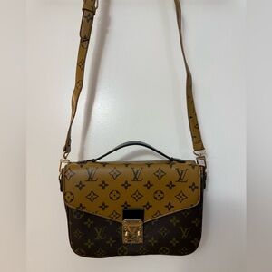 Pochette Metis in the Monogram Reverse canvas Crossbody Bag